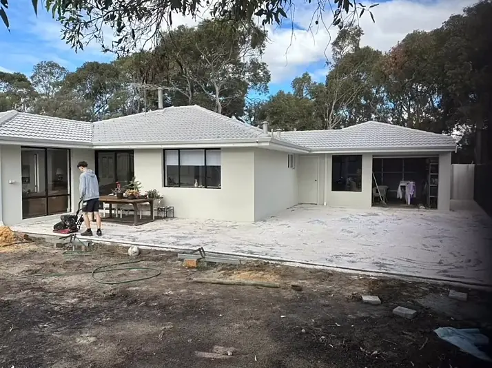 Large backyard paved right up to the house