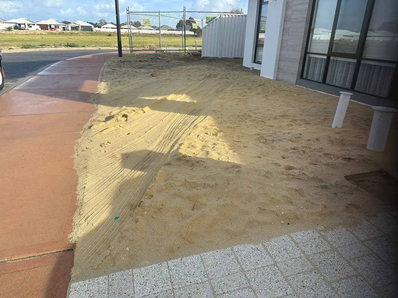 New build front yard in Brabham covered in loose builder's sand