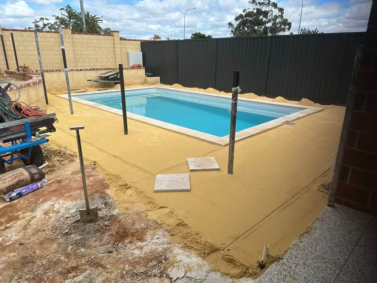 Pool surround screeded with yellow sand before the paving goes down